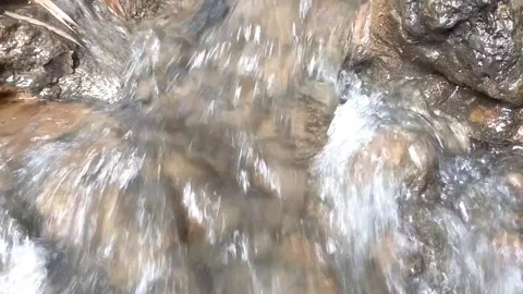 Clear water flowing over the rocks Stock Footage 332156033