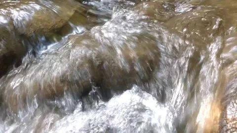 Clear water flowing on the rocks Stock Footage 333157742