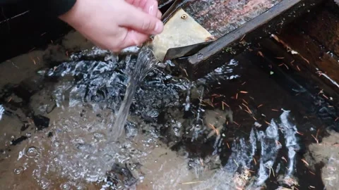 Clear Water Flowing from a Rusty Drain at a Quiet Spot in Nature Stock-Footage 295331958