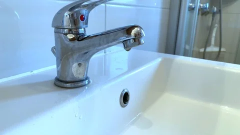 Clear water flowing from the tap Stock Footage 104795508