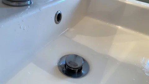 Clear water flowing from the tap Stock Footage 104795625