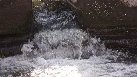 Clear water flows down with a splash. Stock Footage 130239728