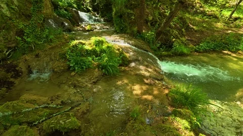 Clear water flows over mossy stones. Gostilje Waterfall, Serbia. Stock Footage 337061325