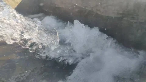 Clear water flows profusely from the irrigation pipes of the fields, Stock Footage 249393417
