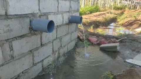 Clear water flows profusely from the irrigation pipes of the fields, Stock Footage 249393429