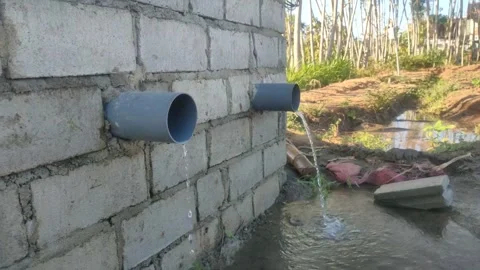 Clear water flows profusely from the irrigation pipes of the fields, Stock Footage 249393431