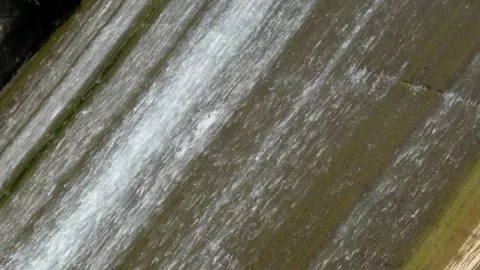 Clear water flows swiftly in the dam Video stock 321798664