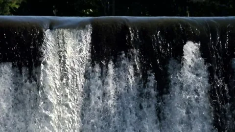 Clear water flows through the dam Stock Footage 280390476