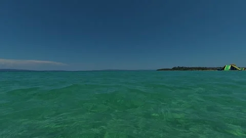 Clear water glows softly beneath surface. Trani Ammouda, Greece Stock Footage 339615170