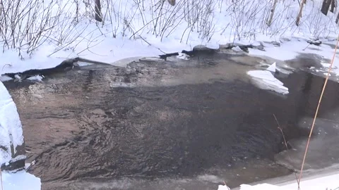 Clear water in an icy river Video stock 168104497