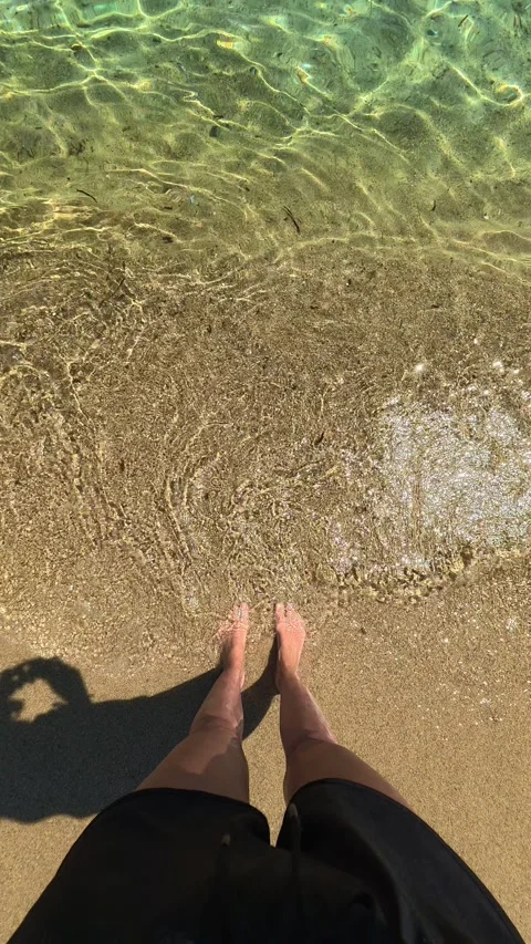 Clear water laps at sandy beach. Trani Ammouda, Vertical Stock Footage 340651998