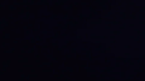 Clear water liquid falling and pouring across black backdrop C Stock Footage 109572461