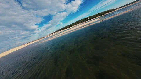 Clear water meets sunlit sand Video stock 340904940