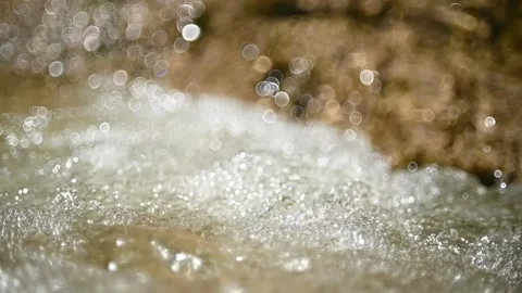 Clear water from a mountain stream with bubbles (slow motion, bokeh) Stock-Footage 219650085