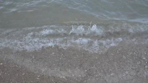 Clear water ocean waves lapping on the shore at Gulf of thailand beach. Stock Footage 133515427