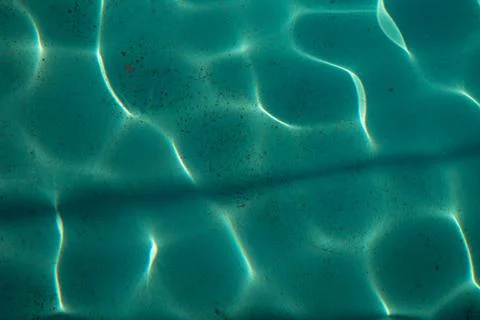Clear water pool with shine rays sun Stock Photos