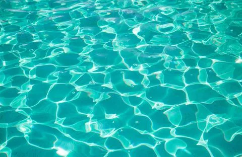 Clear water pool with shine rays sun Stock-Fotos