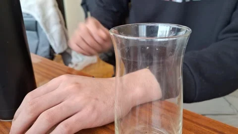 Clear water pours into a glass Stock Footage 332469741