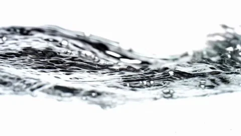 Clear water ripples and bubbles move across white background Stock Footage 329558221