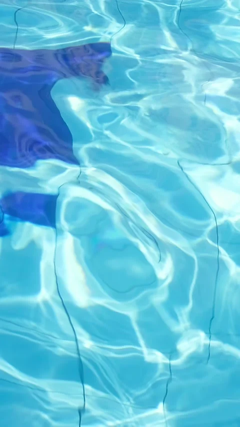 Clear water ripples beneath bright sunlight Stock Footage 340546512