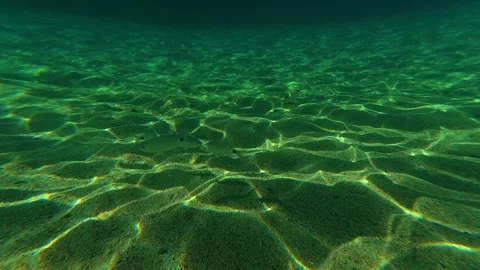 Clear water ripples gently over sandy ocean floor. Lagomandra, Greece Stock Footage 339019929
