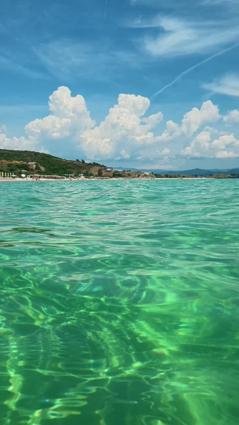Clear water ripples gently under sunlight. Trani Ammouda, Vertical Stock Footage 340650962