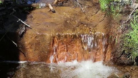 Clear water running in a ditch Stock Footage 108649666