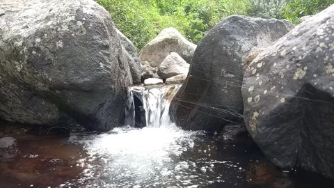 Clear Water Running Down The River Between Rocks 库存影片 244524831