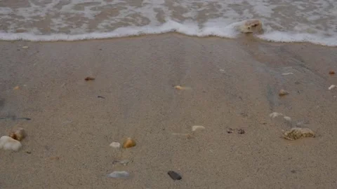 Clear water sea waves lapping and create white foam on beaches with rock. Stock Footage 132891982