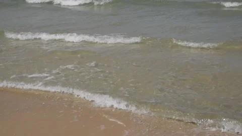 Clear water sea waves lapping and create white foam on beaches. Stock Footage 132892076