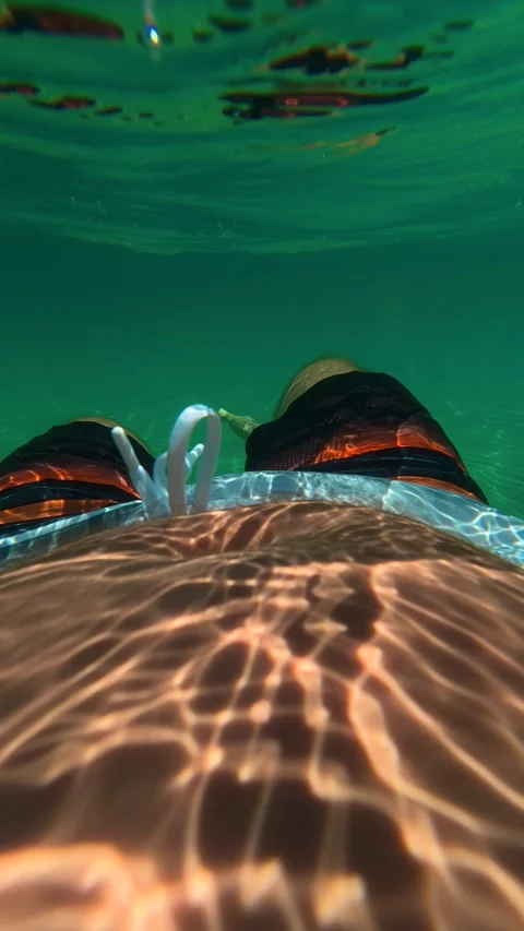 Clear water shimmers under sunlight. Trani Ammouda, Greece. Vertical Vídeo Stock 338358007