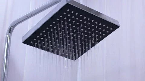 Clear water from shower head pouring down close up Stock Footage 260413039