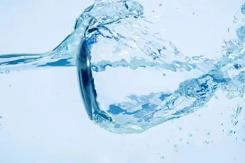 Clear water splash in blue background with motion Stock-Fotos