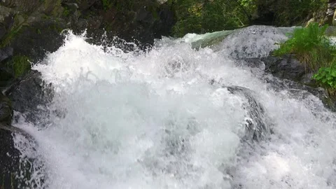 Clear Water splash in mountain stream cascade waterfall Slow motion Stock Footage 293007297