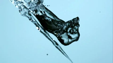 Clear water streams collide and splash together against a blue background. Stock Footage 326626521