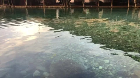 Clear Water Surface with Reflections and Stones Natural Background Video stock 331103594