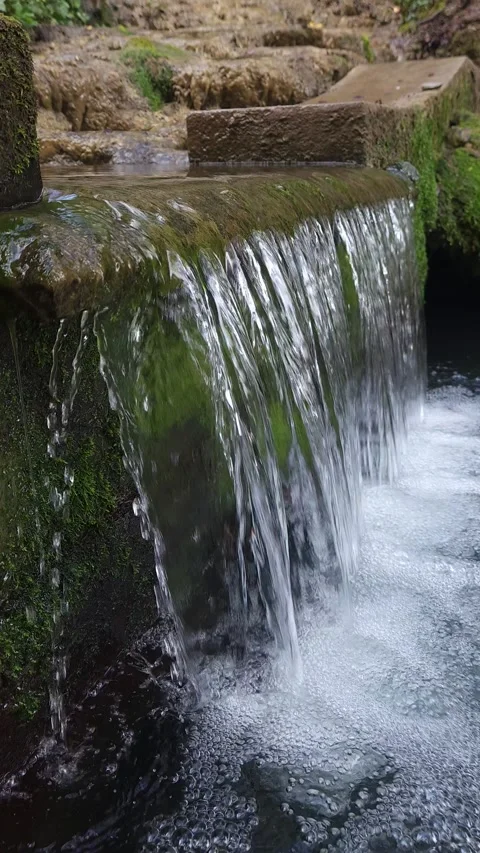 Clear Waterfall Overflow Pouring Over Mossy Stone Ledge Stock Footage 333622135