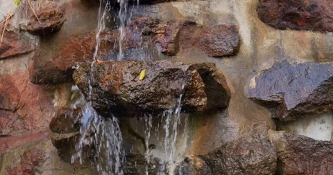 Clear waterfall running through stone boulders in Thailand. Abundant river Stock Footage 245477574