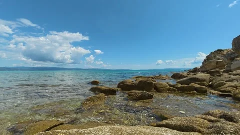 Clear waters lap against rugged stones. Trani Ammouda, Timelapse Stock Footage 340638190