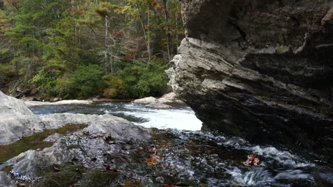 Clear waters of a mountain stream cutting through rock Stockbeeldmateriaal 289915846