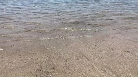 Clear wave water on sandy beach Stock Footage 294327774