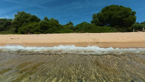 Clear waves roll onto sandy beach. Lagomandra, Greece 스톡 동영상 339023356