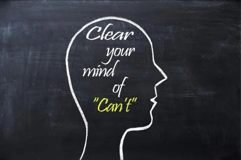 Clear your mind of can't phrase inside human head shape drawn on chalkboard Fotos Stock