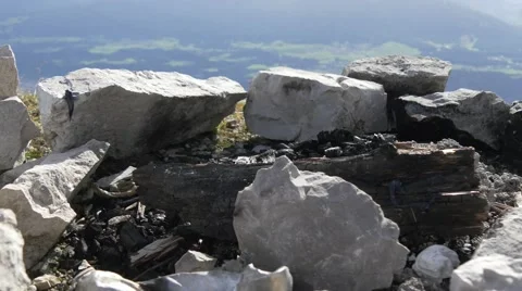 Cleared campfire with burned log in the mountains Stock Footage 43813708