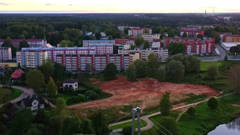 Cleared Construction Plot with Surrounding Apartment Buildings in Valmiera Stock Footage 325956058