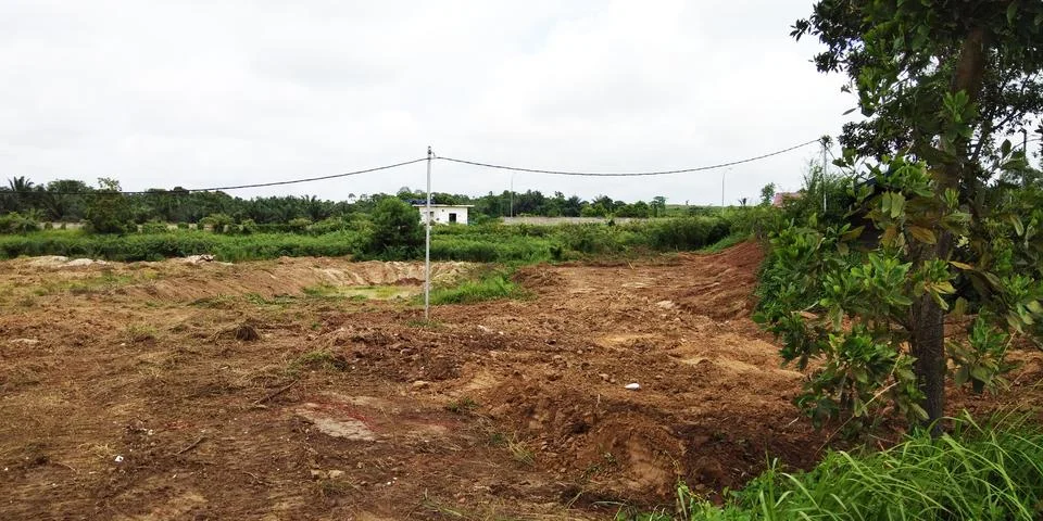 Cleared Earthwork with Distant Structures Stock Photos