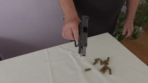 Clearing .45 ACP Pistol with Empty Magazine Close Up Stock Footage 337434644