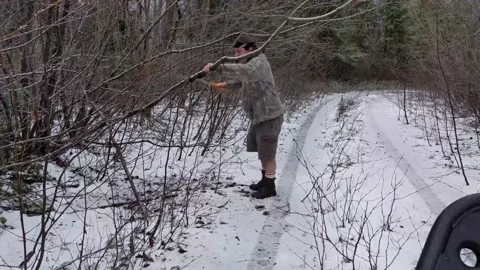 Clearing branches off the trail Stock Footage 172564957