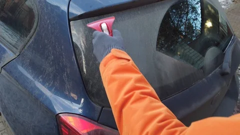 Clearing a car window Stock Footage 120644696