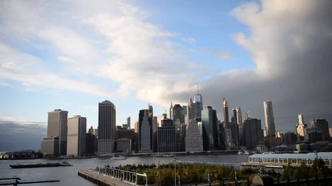 Clearing Clouds and the Lower Manhattan New York City skyline on a fall day Stock Footage 97448159